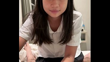An 18-year-old Asian girl in a school uniform gets fucked by a big white cock